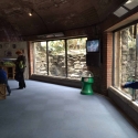 Refurbishment -low iron laminated glass panels mounted in polished stainless steel mullions replacing scratched laminated glass viewing panels