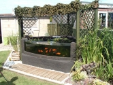 Domestic pond with formed acrylic glazing