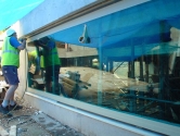 Large glass pool panel installation