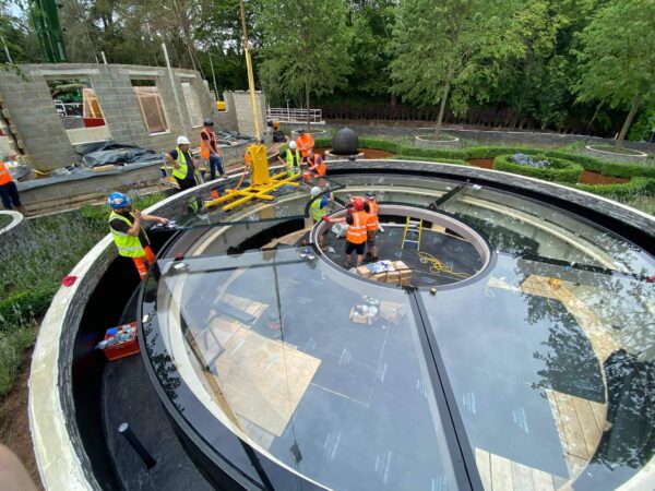 Shaped glass pool windows